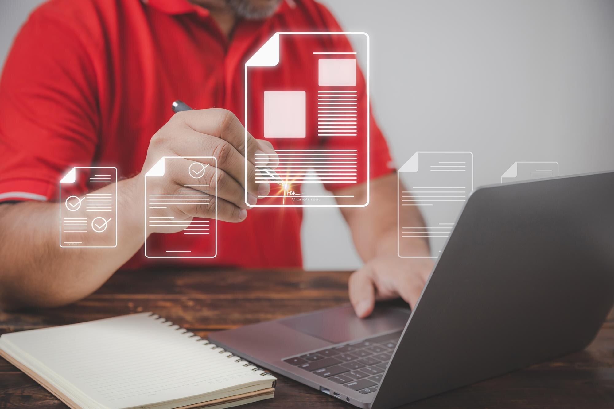 Mężczyzna korzystający z laptopa pracujący na starym drewnianym stole używa dokumentu elektronicznego ze znakiem pióra z przestrzenią do kopiowania edocument management koncepcja biura bez papieru